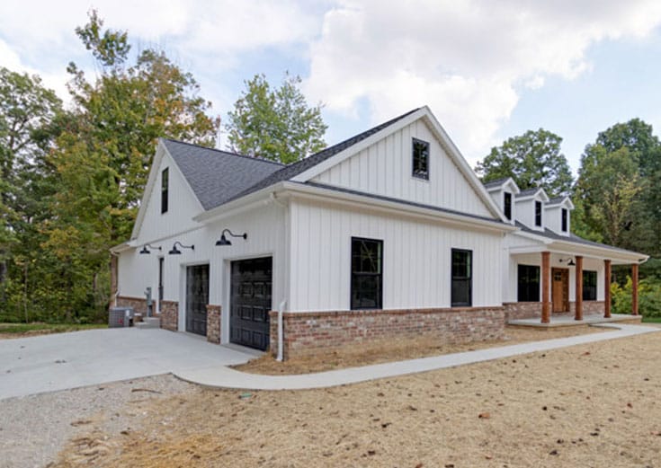 New home built with dirt in yard