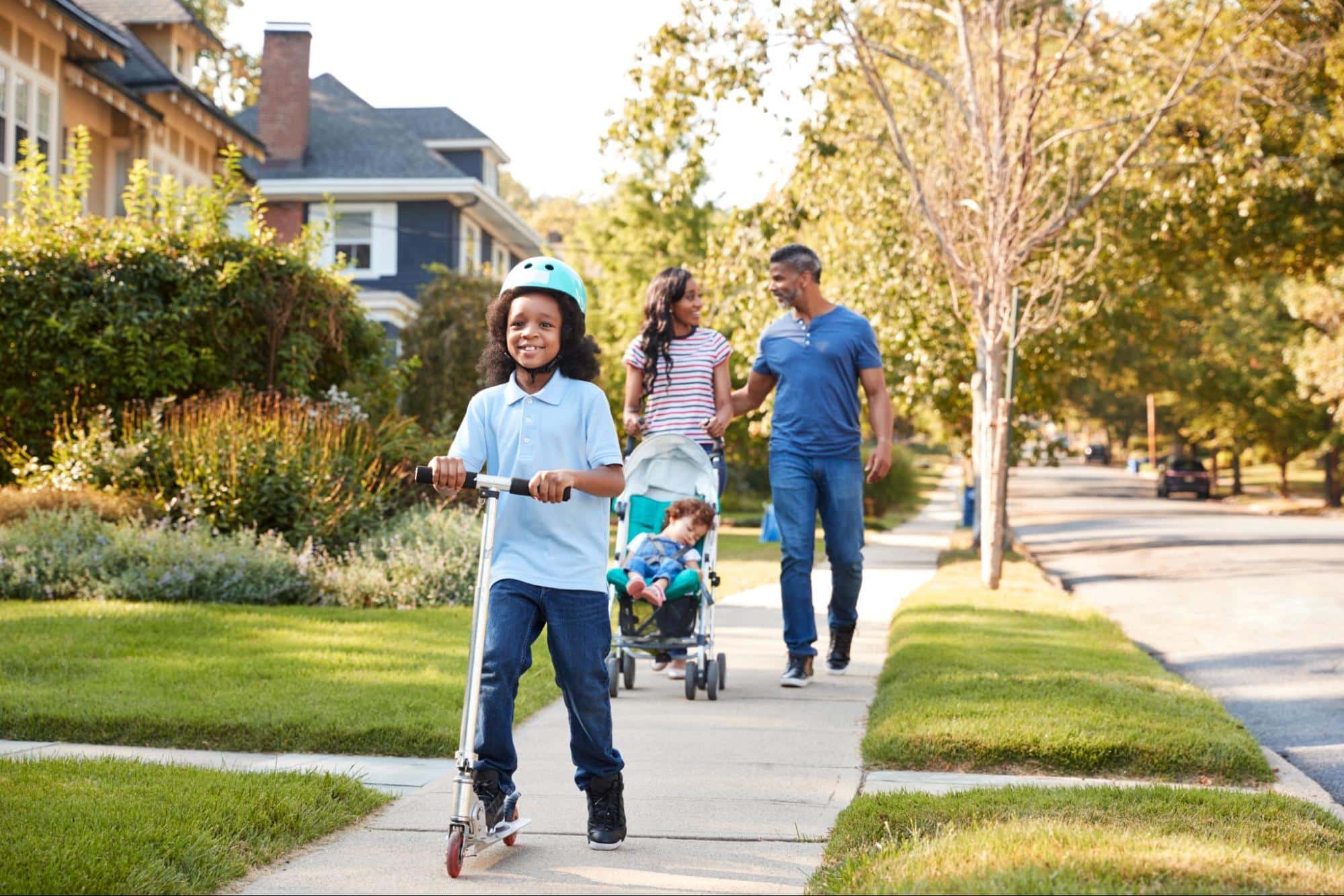 A family walking around the neighborhood of their new construction home..
