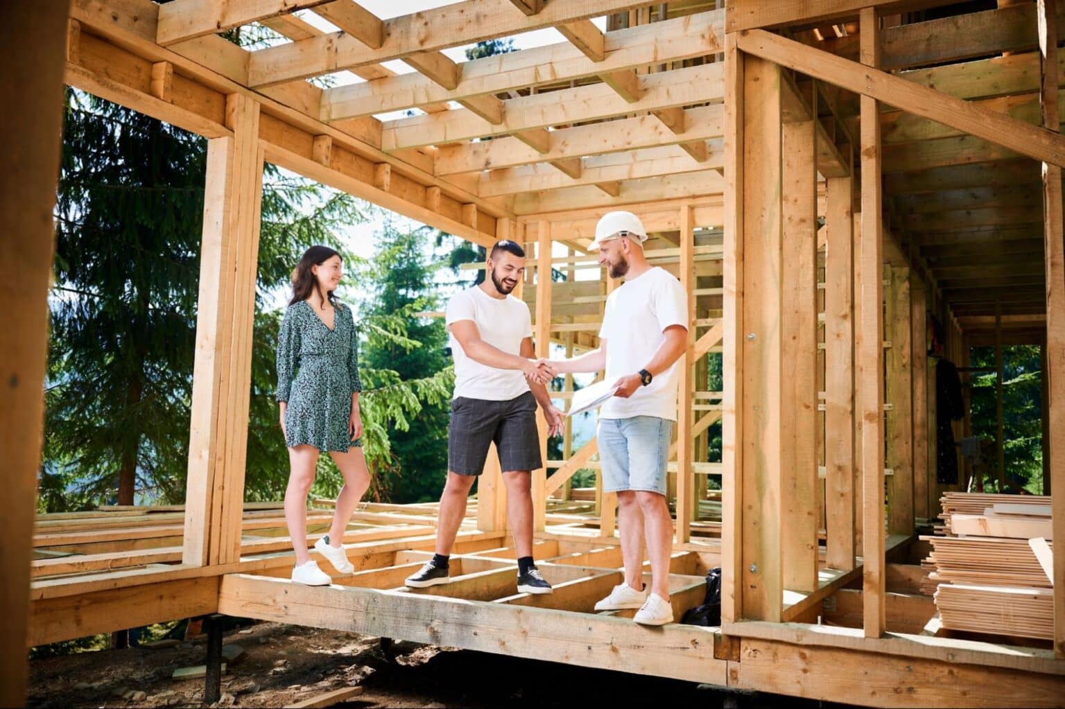 Construction team collaborating on-site for project planning and development.