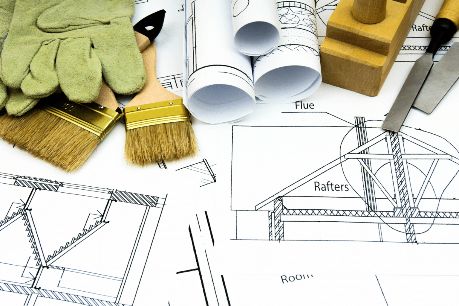 Construction tools and blueprints showcasing essential equipment for building projects.
