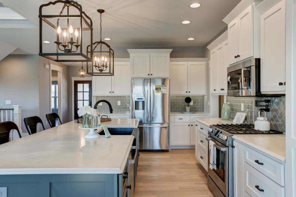 Stylish modern kitchen featuring elegant lighting and sleek design elements.