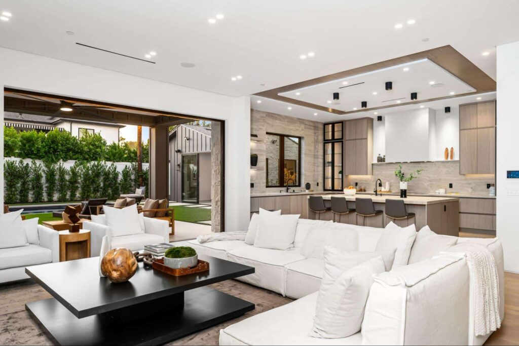 Modern living room design with a spacious layout and elegant decor elements.