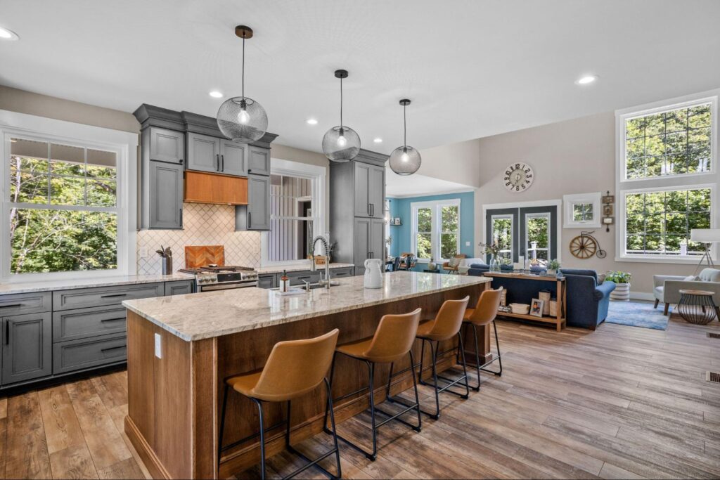 Modern kitchen with island seating, stylish cabinetry, and bright natural light.