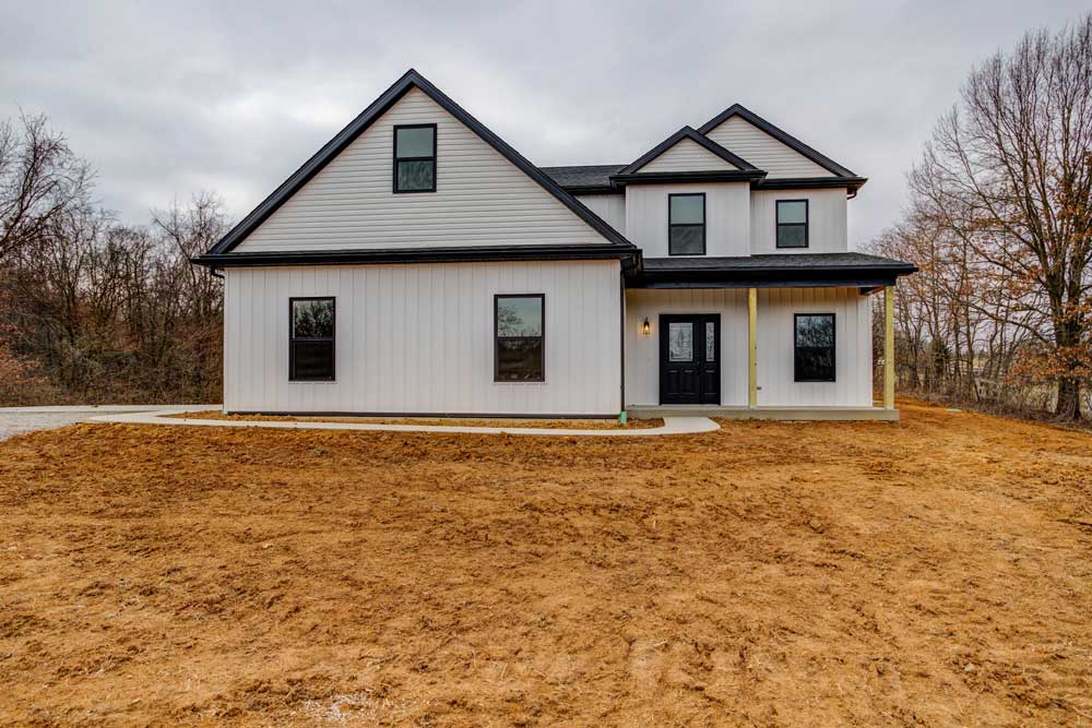 Charming modern farmhouse surrounded by spacious grounds and natural beauty.