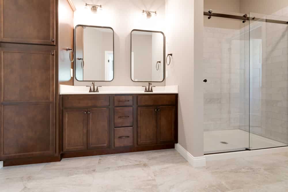 Sleek modern bathroom design with dual vanities and a stylish glass shower.