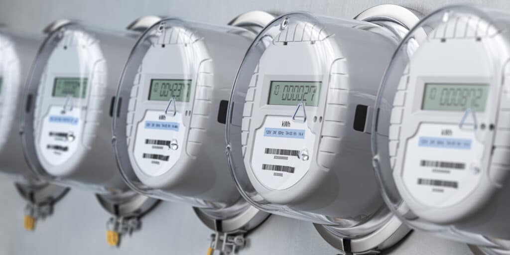 Digital electric meters lined up for measuring electricity consumption and power usage.