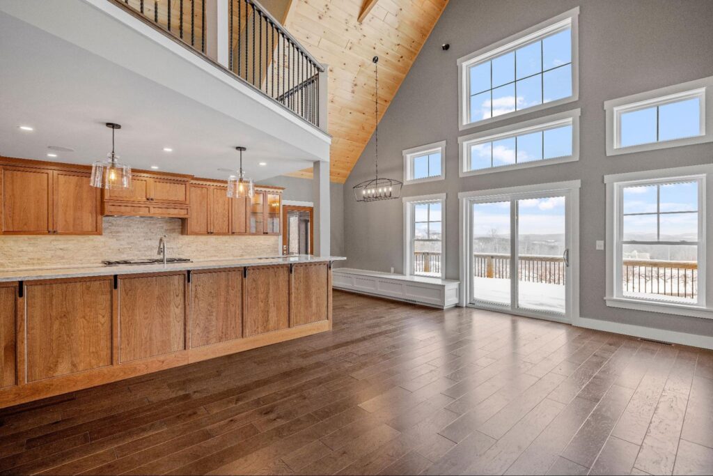 Stylish open-concept living space with panoramic windows and stunning natural views.