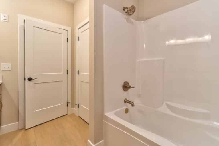 Modern bathroom featuring a sleek shower and tub combination for relaxation and convenience.