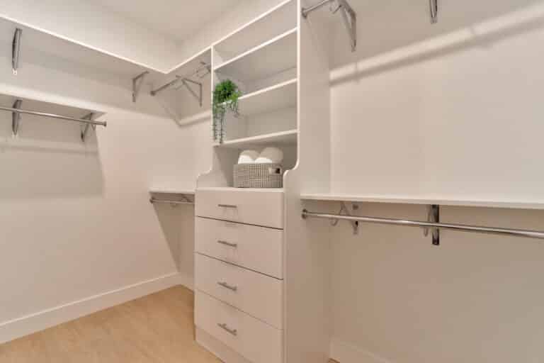 Stylish clean closet storage with shelves, drawers, and hanging space for organization.