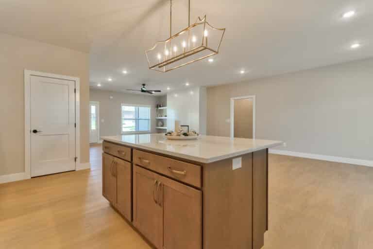 Modern kitchen interior featuring elegant lighting and a spacious design.