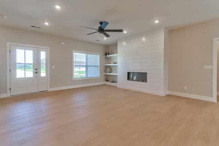 Modern living room with elegant design, bright space, and stylish fireplace ambiance.