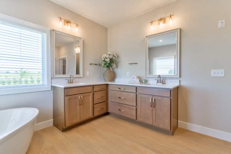 Elegant modern bathroom design with spacious vanity and stylish lighting fixtures.