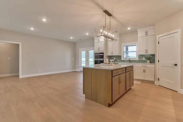 Spacious modern kitchen interior with stylish cabinetry and open floor design.