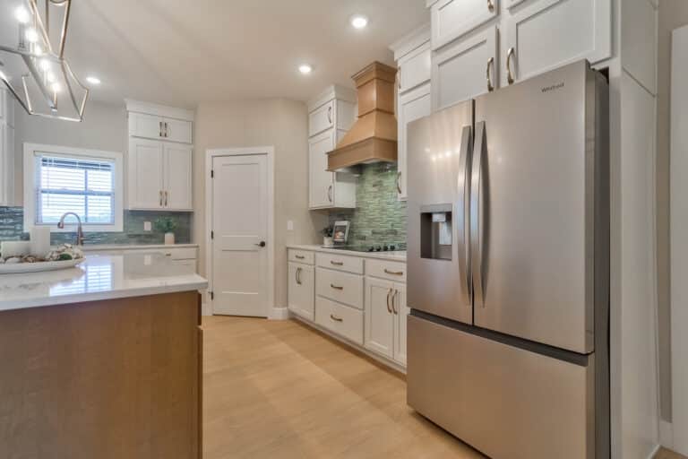 Stylish modern kitchen featuring sleek cabinetry, stainless steel appliances, and elegant design elements.