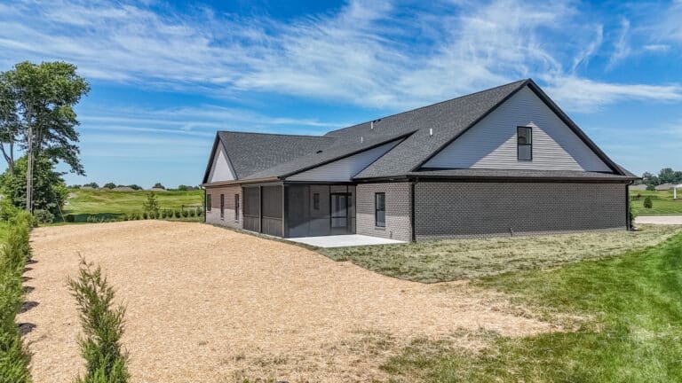 Beautiful modern home exterior with a spacious yard and scenic views.