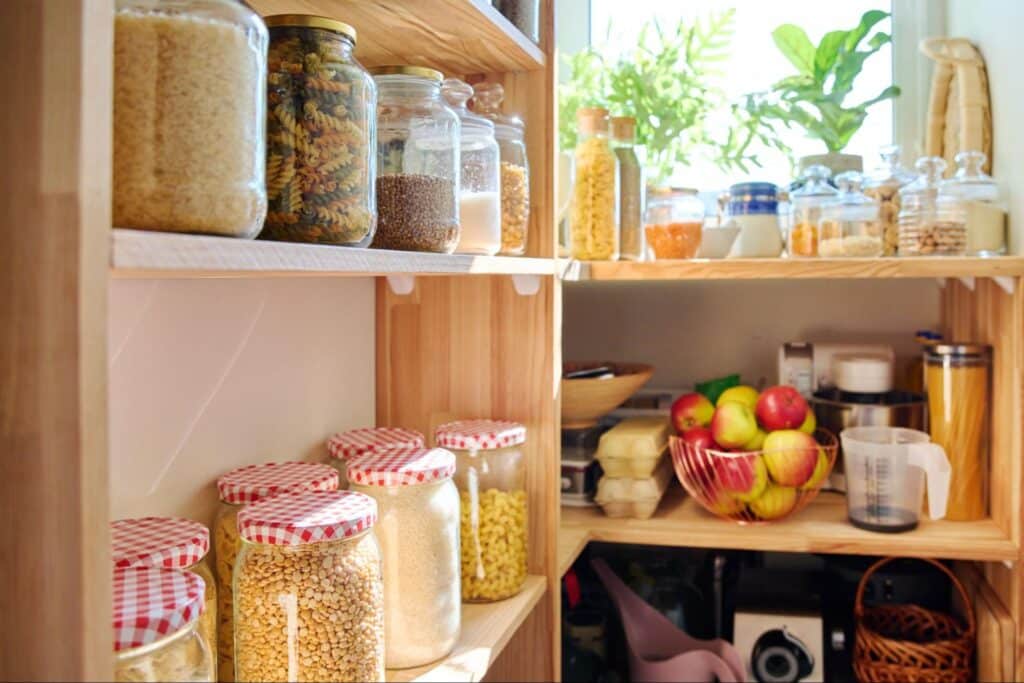 Pantry stocked with grains, herbs, and fresh fruits for nutritious cooking.