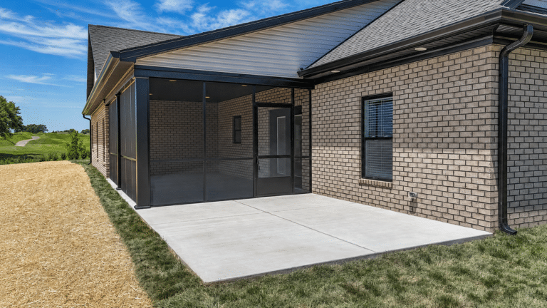 Spacious screened porch enhancing outdoor living, perfect for relaxation and entertaining.