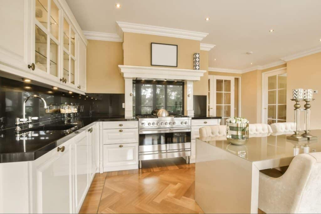 Stylish kitchen with modern cabinets and cozy dining area for elegant living.