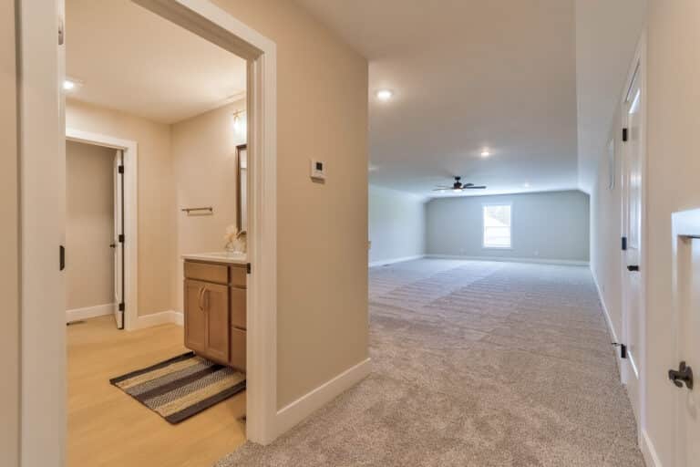 Spacious living room with natural light and modern design elements for comfortable living.