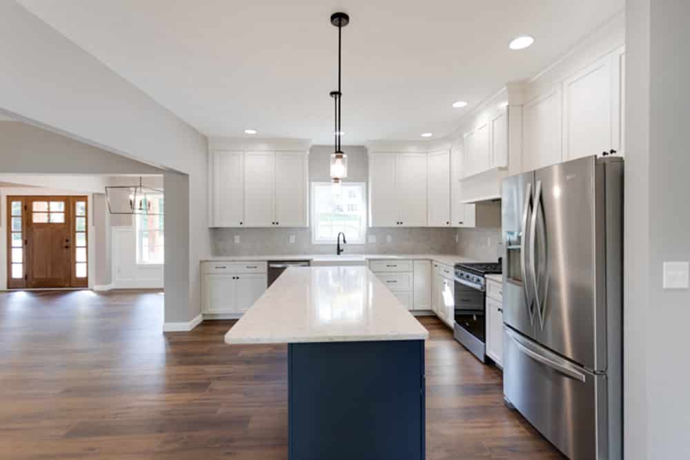 Sleek kitchen design with island, stainless steel appliances, and modern finishes.