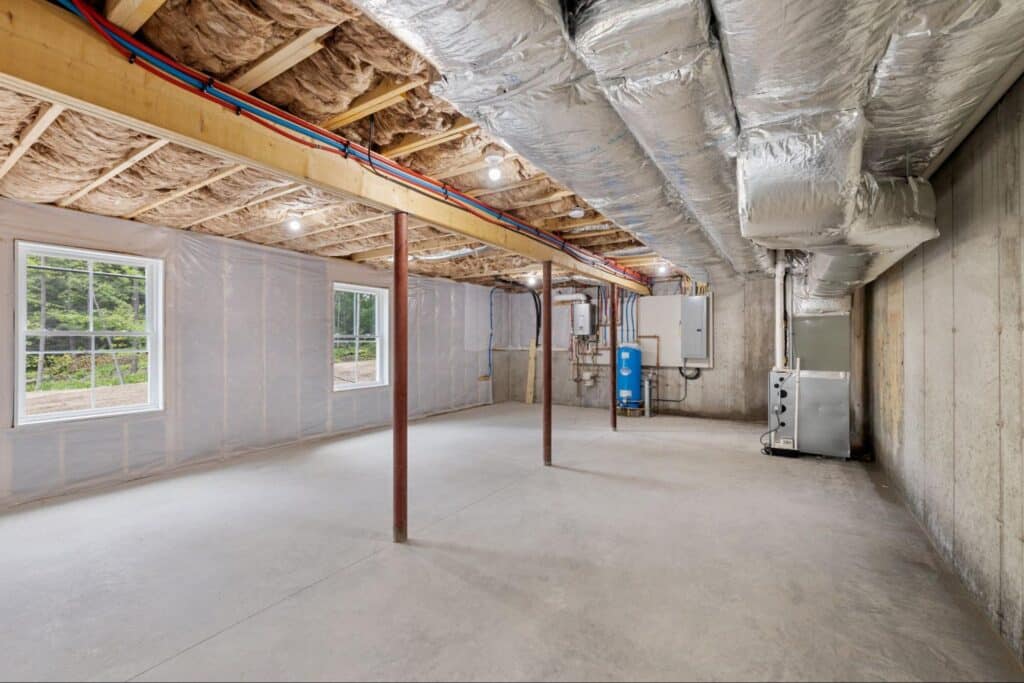 Spacious unfinished basement with windows, ideal for creating your dream living space.