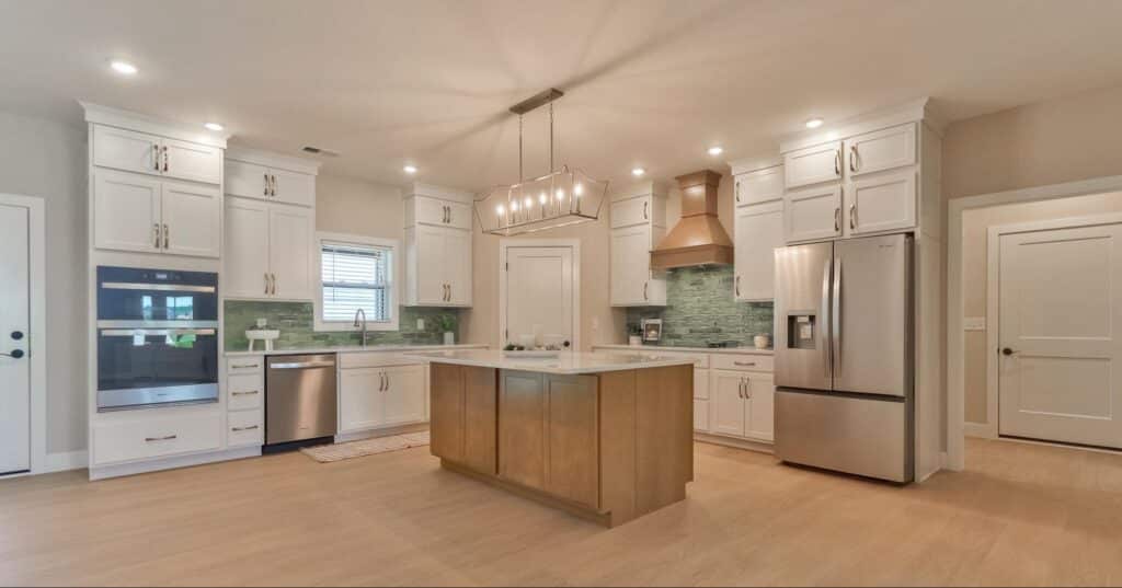 Sleek modern kitchen design with custom cabinetry and stainless steel appliances.