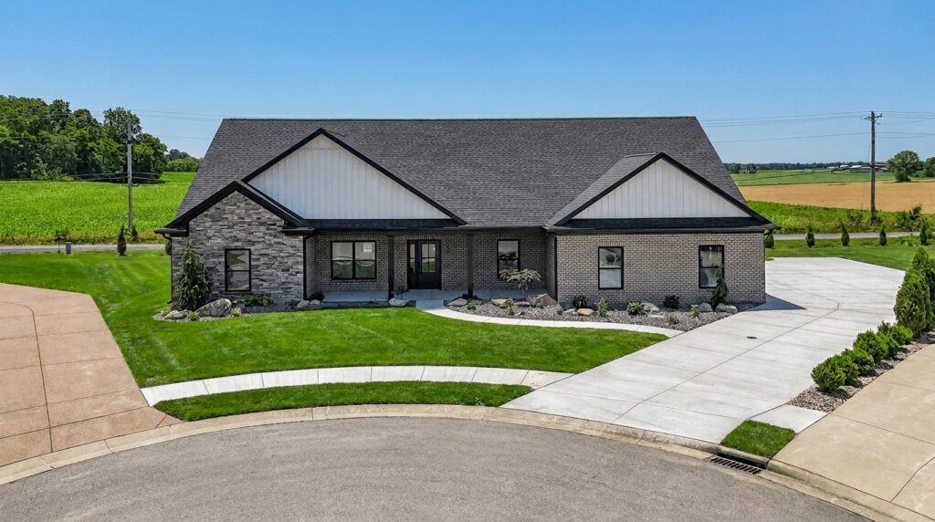 Modern home design featuring a stylish facade and beautifully landscaped yard.