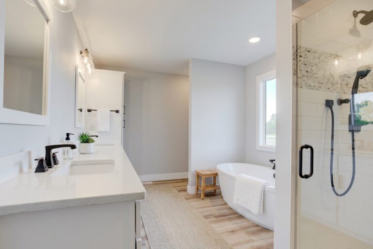 Modern bathroom design featuring sleek fixtures and a relaxing tub for ultimate comfort.