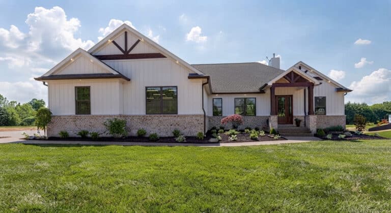 Modern home exterior with a stylish design, lush landscaping, and inviting entryway.