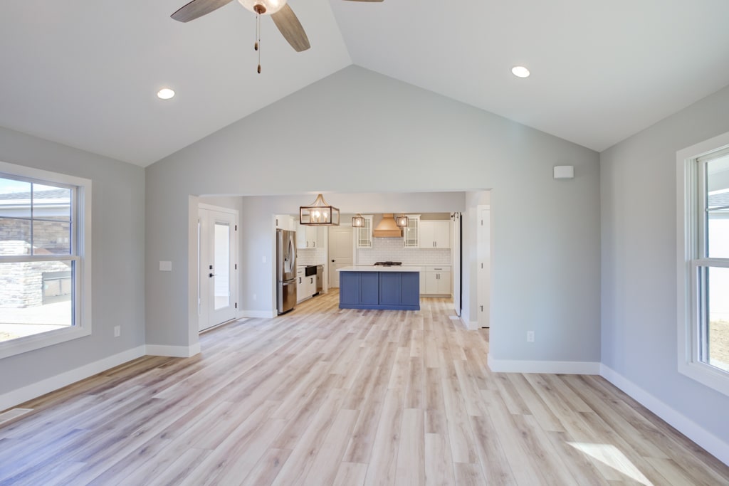 Spacious modern open concept kitchen with stylish design and natural light.