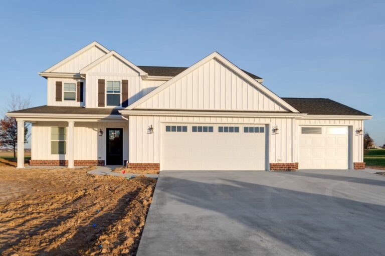 Modern home design featuring a stylish exterior and spacious driveway.