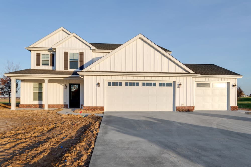 Modern home design featuring a stylish exterior and spacious driveway.